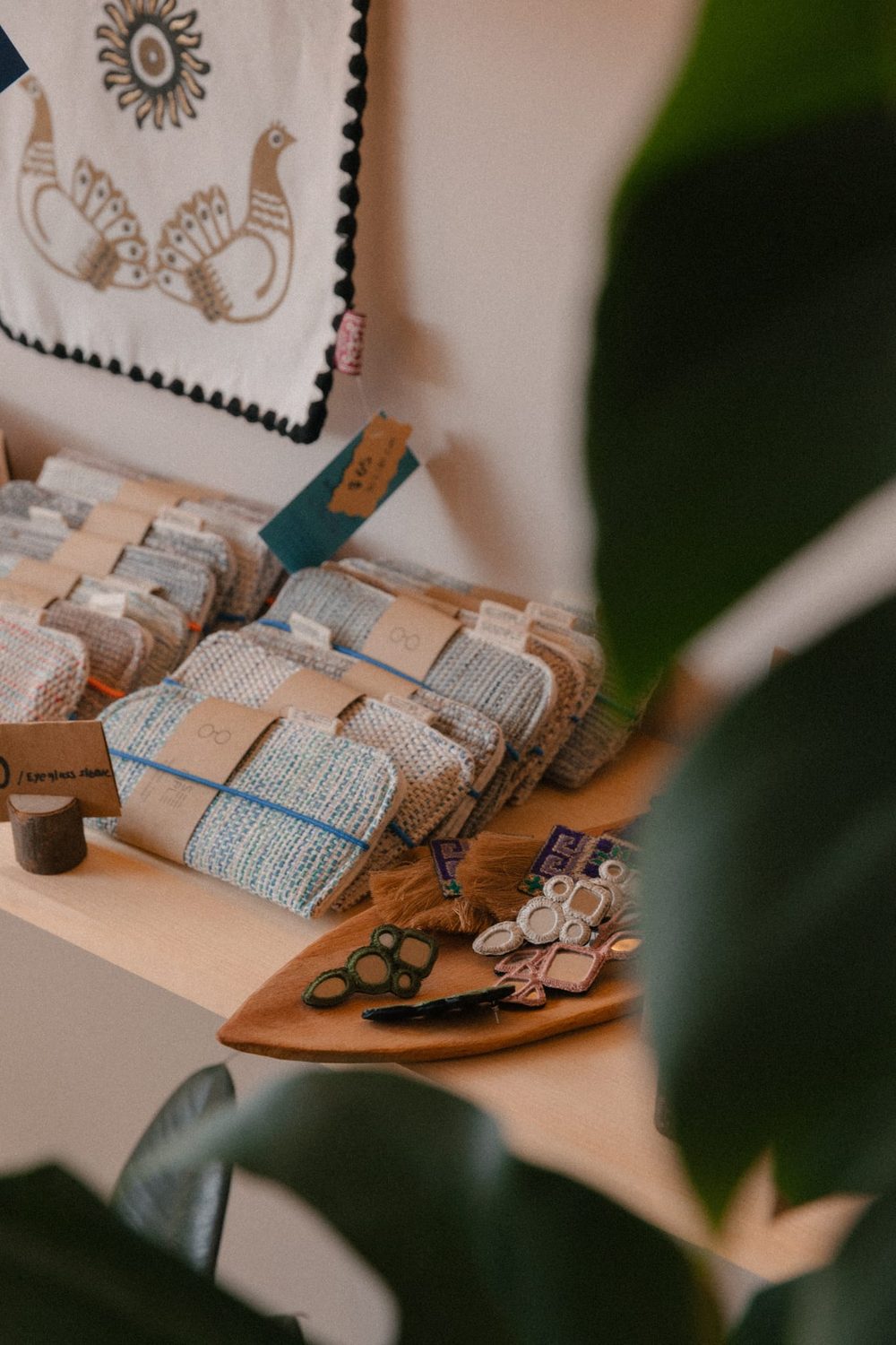 Handwoven textiles and Persian-patterned craft details displayed inside Hayaat