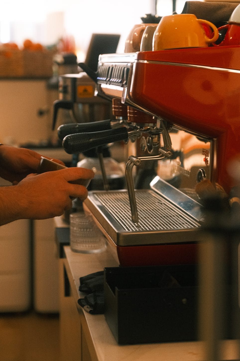 A barista pulling espresso behind the bar at Hayaat